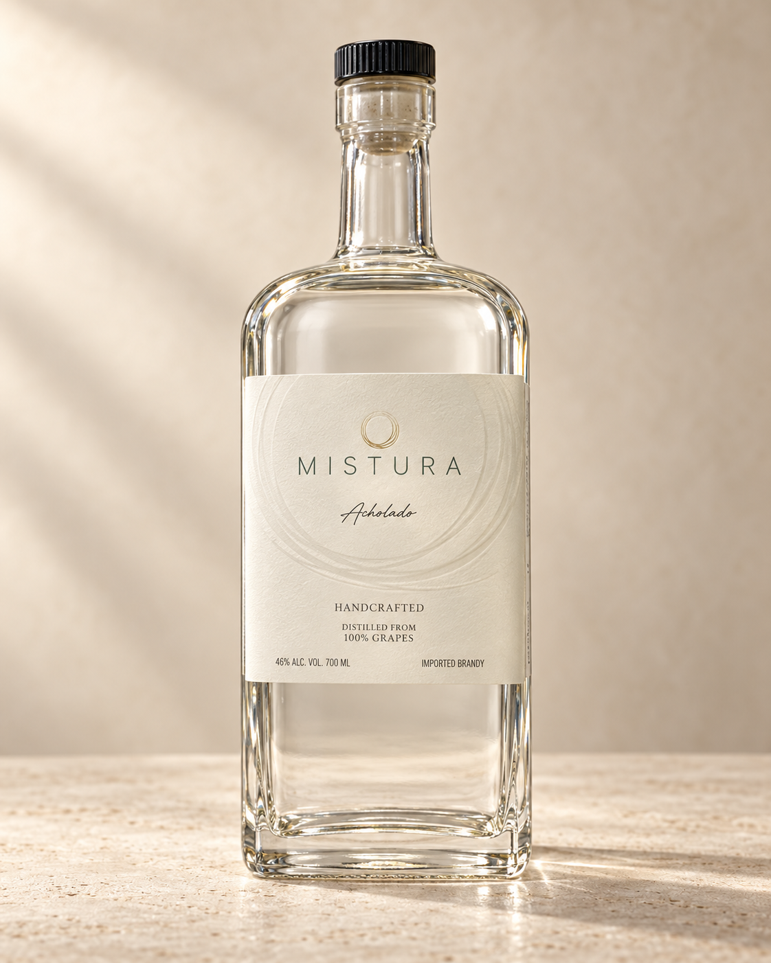 Mistura Acholado pisco bottle with soft studio lighting against a warm ivory backdrop